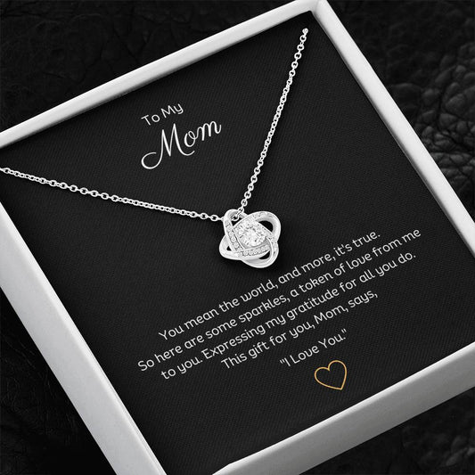 To My Mom, Beautiful Love Knot 14k or 18k finish Necklace. Features a beautiful pendant embellished with premium cubic zirconia crystals.