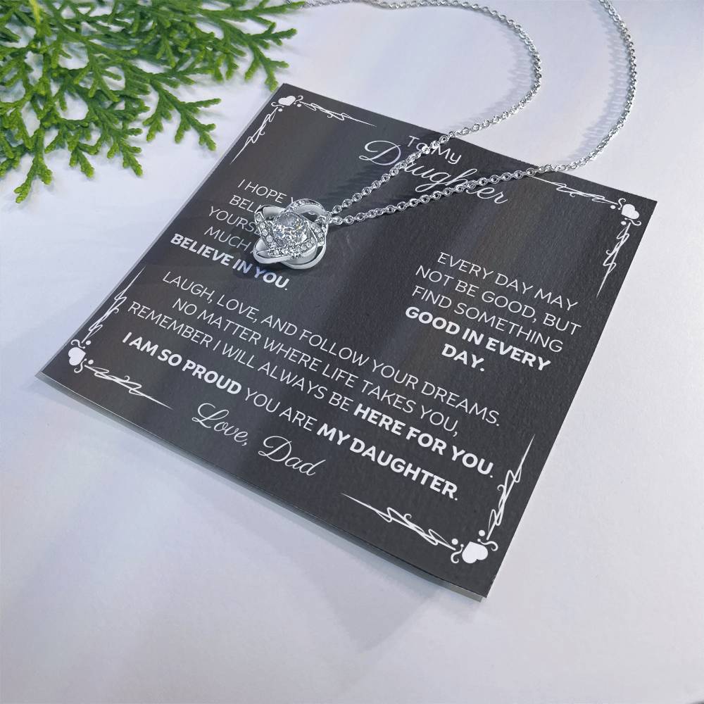 To My Daughter Love Knot Necklace with heartfelt message card and gift box love from Dad. 14k white gold over stainless steel embellished with premium cubic zirconia crystals. Adjustable chain length: 18" - 22" (45.72cm - 55.88cm)