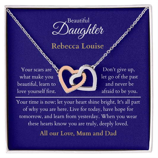 Personalised Beautiful Daughter Interlocking Hearts Necklace, two heart pendants embellished with CZ crystals High quality polished surgical steel and rose gold finish. With a Heartfelt message starting with: Your scars are what make you beautiful.