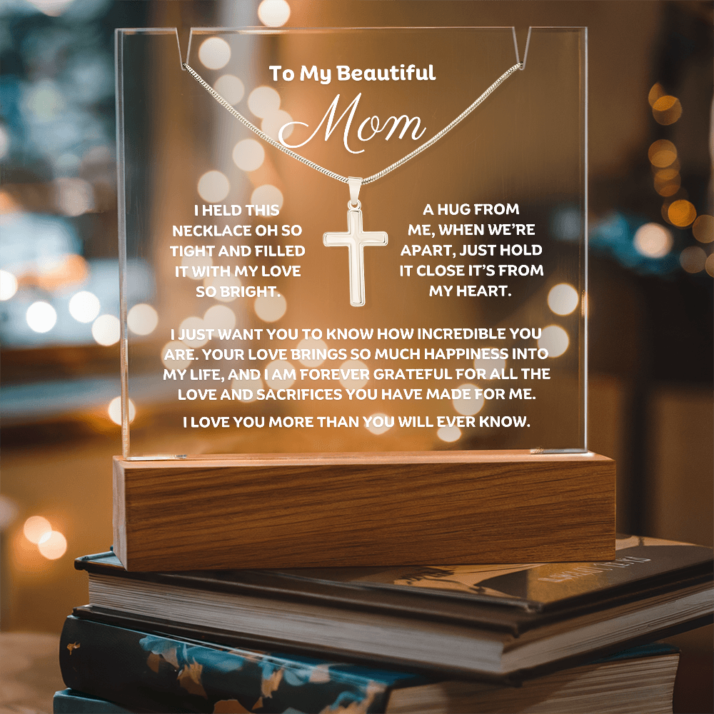 Show Mom how much you love her with this stunning Square Acrylic plaque paired with a beautiful Polished Stainless Cross Pendant Necklace. The beautiful Mom heartfelt message is showcased on crystal-clear acrylic with 7 colour LED lighting, making this set a striking focal point in any space. 