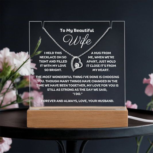 A stunning Square Acrylic and the beautiful Forever Love Heart Necklace for your Wife. The beautiful wife heartfelt message is showcased on crystal-clear acrylic, making this set a striking focal point in any space. Paired with the charming Forever Love Heart Necklace in 14k white Gold or 18k gold plated.