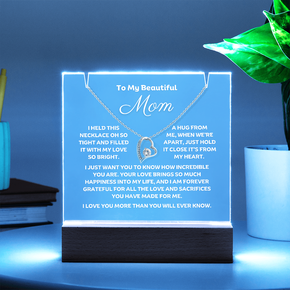 Sow Mom how much you love her with this stunning Square Acrylic and the beautiful Forever Love Heart Necklace for Mum. The beautiful wife heartfelt message is showcased on crystal-clear acrylic, making this set a striking focal point in any space. Paired with the charming Forever Love Heart Necklace in 14k white Gold or 18k gold plated.
