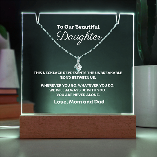 A stunning Square Acrylic plaque paired with the beautiful Alluring Beauty Pendant, Embellished With Cubic Zirconia Crystals Necklace for your Daughter. The beautiful Daughter heartfelt message is showcased on crystal-clear acrylic, making this set a striking focal point in any space. Paired with the charming Alluring Beauty Necklace.