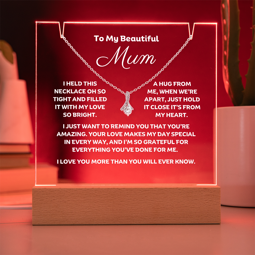 A stunning Square Acrylic plaque paired with the beautiful Alluring Beauty Pendant, Embellished With Cubic Zirconia Crystals Necklace for Mum. The beautiful mum heartfelt message is showcased on crystal-clear acrylic, making this set a striking focal point in any space. Paired with the charming Alluring Beauty Necklace.