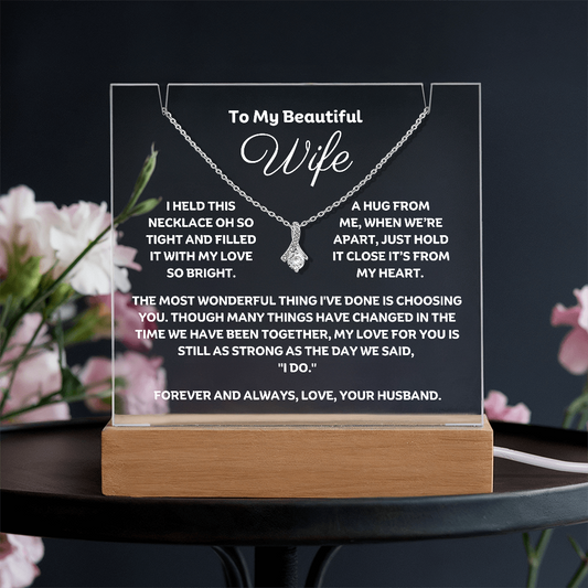 A stunning Square Acrylic plaque paired with the beautiful Alluring Beauty Pendant, Embellished With Cubic Zirconia Crystals Necklace for your wife. The beautiful wife heartfelt message is showcased on crystal-clear acrylic, making this set a striking focal point in any space. Paired with the charming Alluring Beauty Necklace.