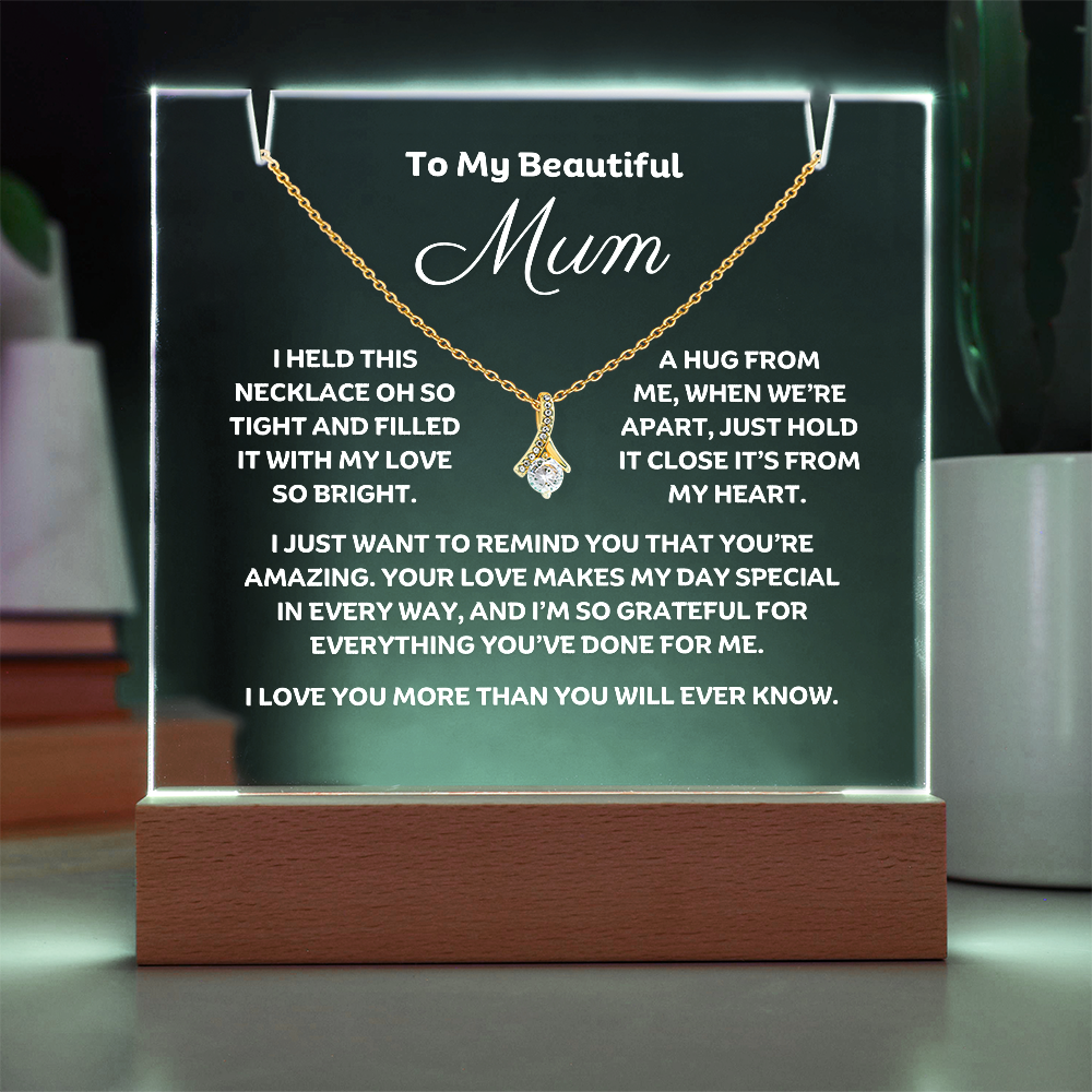 A stunning Square Acrylic plaque paired with the beautiful Alluring Beauty Pendant, Embellished With Cubic Zirconia Crystals Necklace for Mum. The beautiful mum heartfelt message is showcased on crystal-clear acrylic, making this set a striking focal point in any space. Paired with the charming Alluring Beauty Necklace.