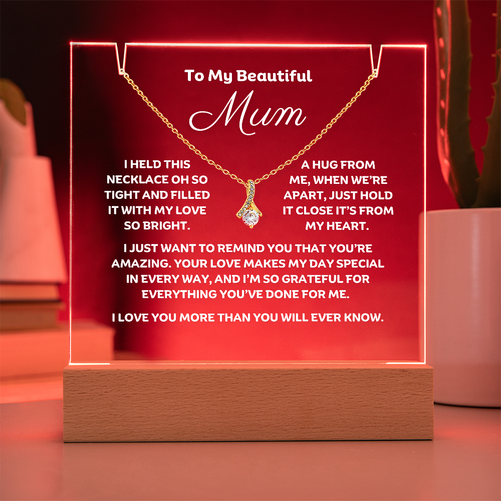 A stunning Square Acrylic plaque paired with the beautiful Alluring Beauty Pendant, Embellished With Cubic Zirconia Crystals Necklace for Mum. The beautiful mum heartfelt message is showcased on crystal-clear acrylic, making this set a striking focal point in any space. Paired with the charming Alluring Beauty Necklace.