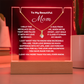 A stunning Square Acrylic plaque paired with the beautiful Alluring Beauty Pendant, Embellished With Cubic Zirconia Crystals Necklace for Mum. The beautiful mum heartfelt message is showcased on crystal-clear acrylic, making this set a striking focal point in any space. Paired with the charming Alluring Beauty Necklace.