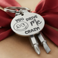 Engraved keychain screwdriver for your loved one with flathead and Philips. Cheeky message reads You drive me crazy! with a googly face. Add your own engraved message on the back. Colour Black or Silver.