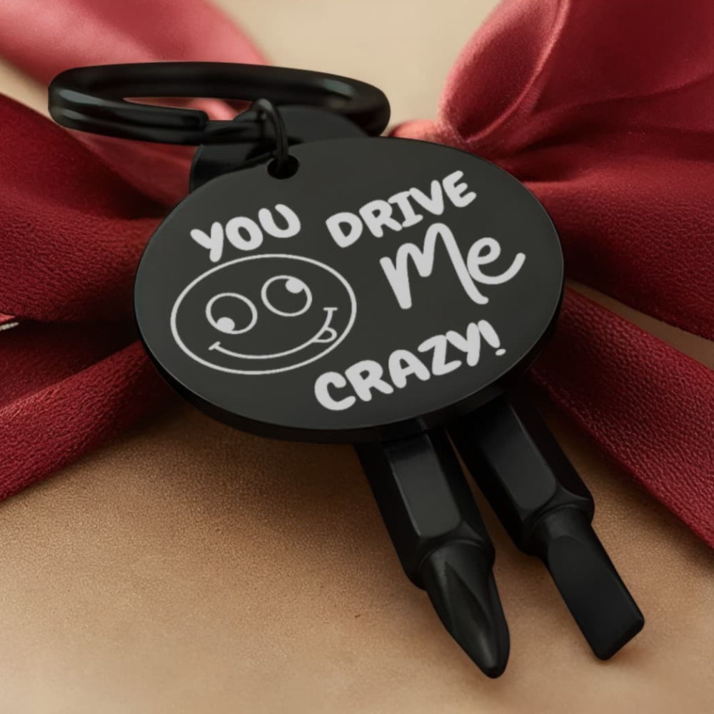 Engraved keychain screwdriver for your loved one with flathead and Philips. Cheeky message reads You drive me crazy! with a googly face. Add your own engraved message on the back. Colour Black or Silver.