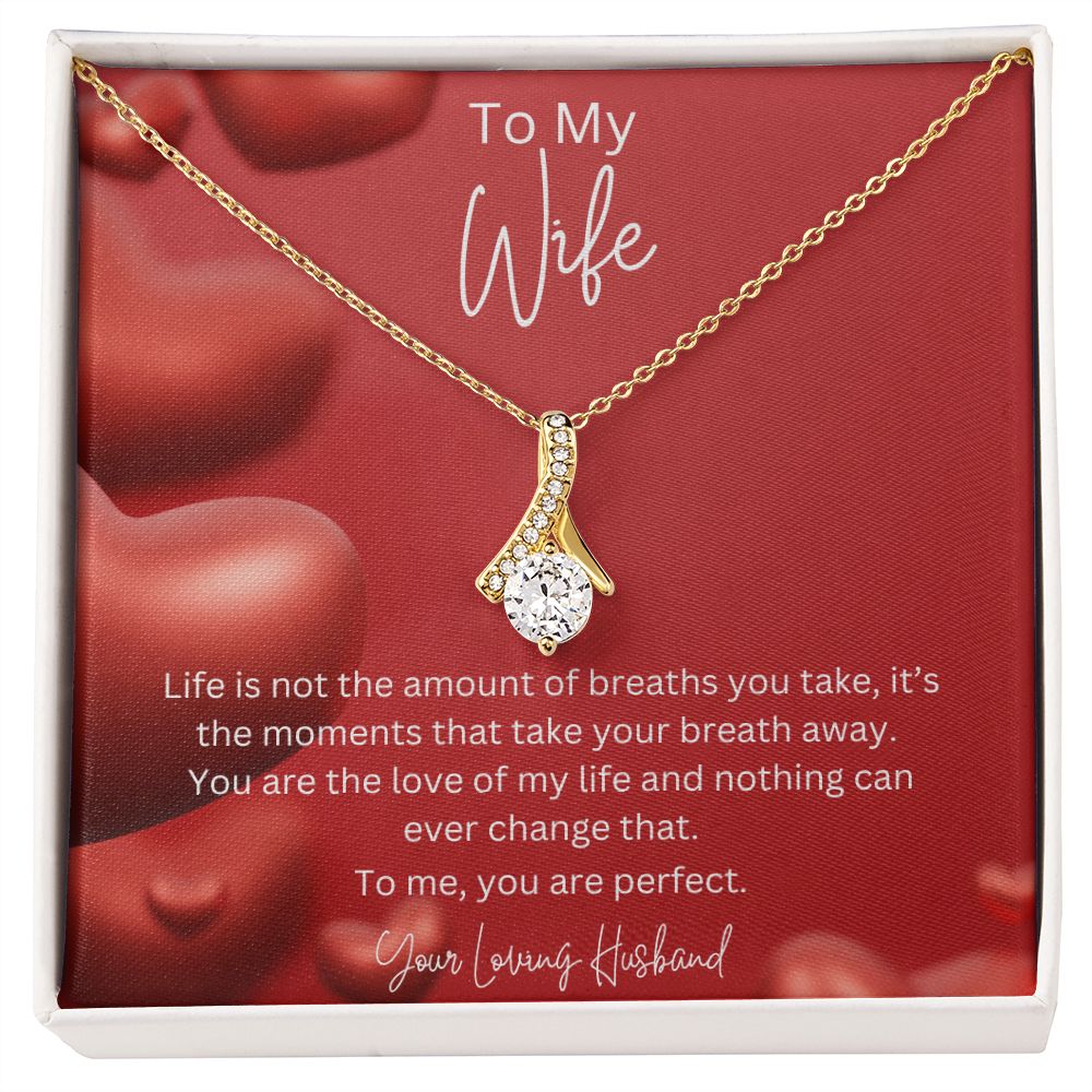 To My Wife Ribbon Shaped Pendant Necklace features a beautiful pendant embellished with premium cubic zirconia crystals. 14k white gold over stainless steel or 18k yellow gold over stainless steel with a heartfelt message card.