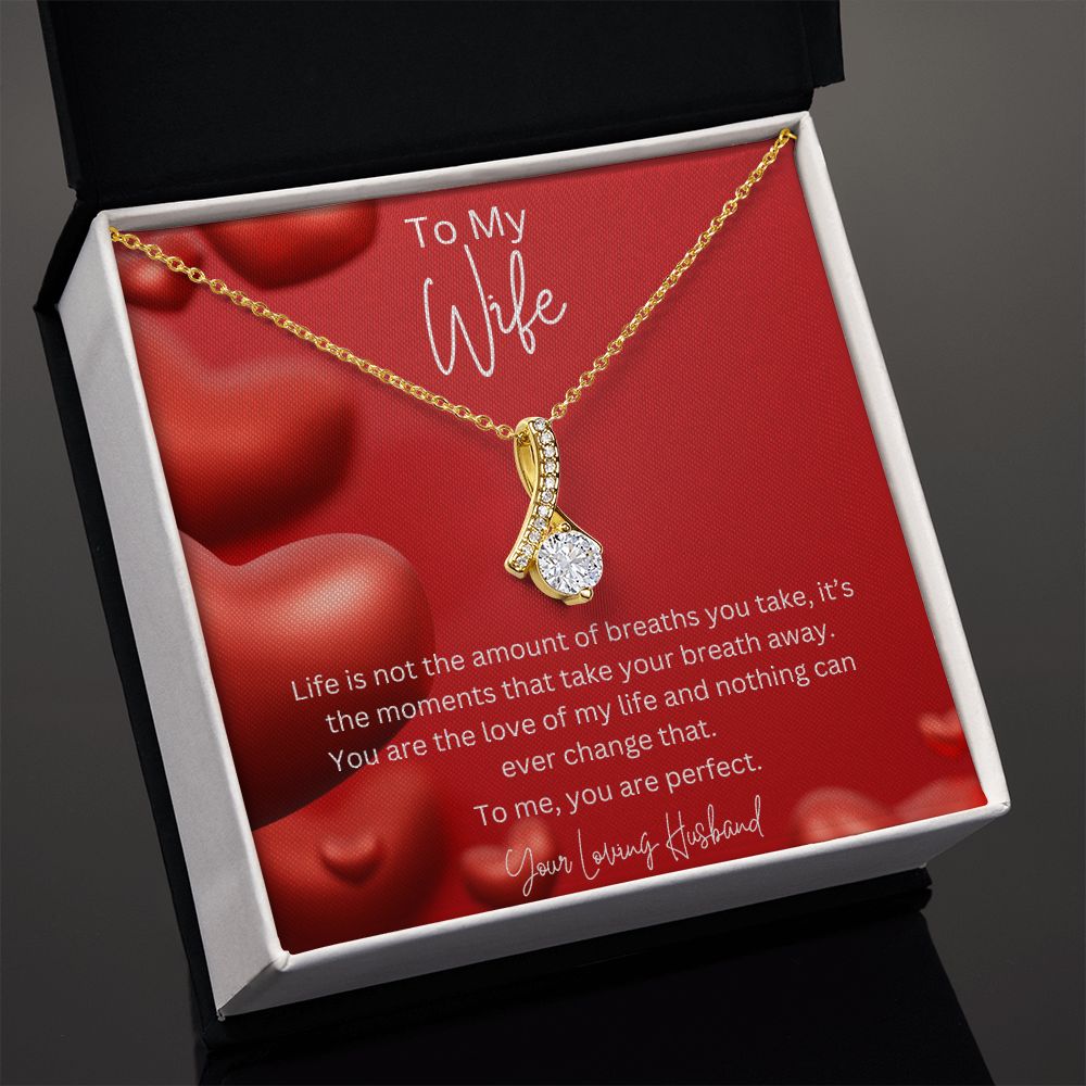 To My Wife Ribbon Shaped Pendant Necklace features a beautiful pendant embellished with premium cubic zirconia crystals. 14k white gold over stainless steel or 18k yellow gold over stainless steel with a heartfelt message card.