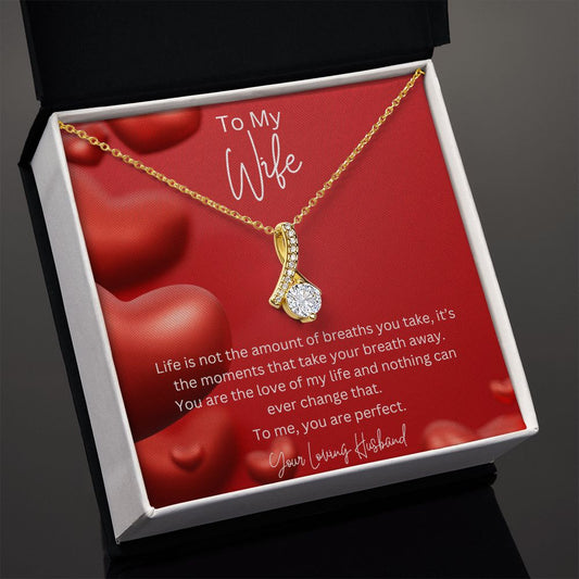 To My Wife Ribbon Shaped Pendant Necklace features a beautiful pendant embellished with premium cubic zirconia crystals. 14k white gold over stainless steel or 18k yellow gold over stainless steel with a heartfelt message card.