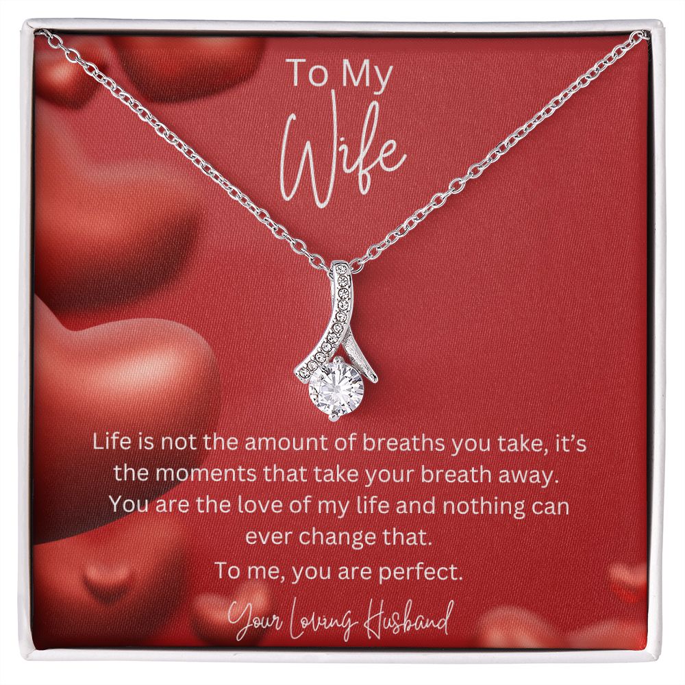 To My Wife Ribbon Shaped Pendant Necklace features a beautiful pendant embellished with premium cubic zirconia crystals. 14k white gold over stainless steel or 18k yellow gold over stainless steel with a heartfelt message card.