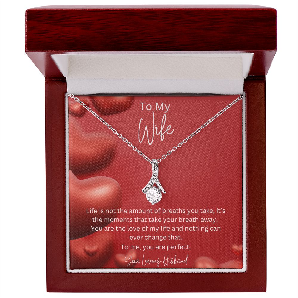To My Wife Ribbon Shaped Pendant Necklace features a beautiful pendant embellished with premium cubic zirconia crystals. 14k white gold over stainless steel or 18k yellow gold over stainless steel with a heartfelt message card.